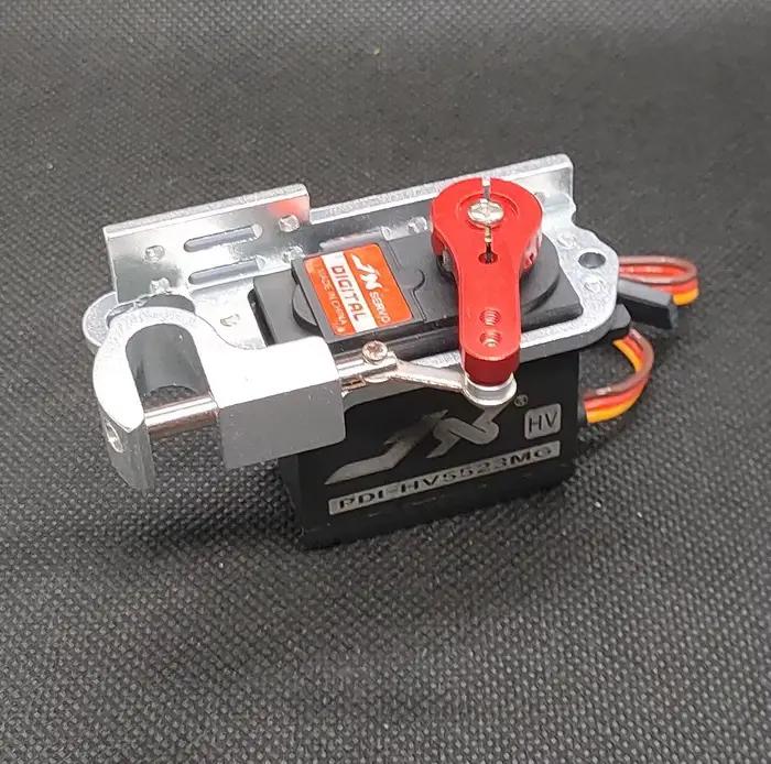JX Servo-Dispositif de libération de marchandises